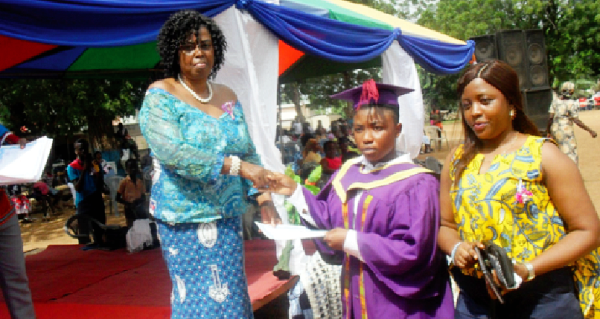 Ms Cecilia Obenewa Appiah (left) the Headmistress of Krobo Girls Senior High School, presenting a certificate to Gifty Maku Tetteh, one of the graduands. Picture: Ezekiel Sottie Ms Cecilia Obenewa Appiah (left) the Headmistress of Krobo Girls Senior High School, presenting a certificate to Gifty Maku Tetteh, one of the graduands. Picture: Ezekiel Sottie